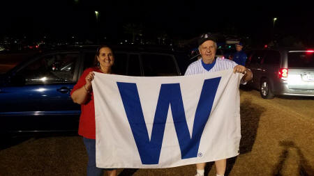 Image may contain: 3 people, including Greg Lopatka, people smiling, people standing and outdoor