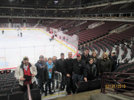 Image may contain: 11 people, people smiling, basketball court and stadium